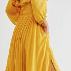 No Longer In Make Color, Yellow Gold Easy Cotton Midi Dress Featured In A Flowy Silhouette With A Smocked Bodice And Volume Sleeves. Ruffled Neckline Adjustable Tie At Bustline Lined Skirt Never Worn. The Color Didn't Work For Me. Yellow Long-sleeved Dress With Pockets, Yellow Long Sleeve Dress With Pockets, Long Sleeve Yellow Dress With Pockets, Yellow Cotton Maxi Dress For Brunch, Yellow Beach Dress With Pockets, Yellow Vacation Dress With Pockets, Yellow Dress With Pockets For Vacation, Yellow Midi Dress With Pockets, Yellow Bohemian Midi Dress For Brunch