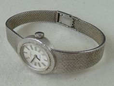 Offered for sale; Original 1970s ladies cocktail bracelet watch, dial marked UNIONA II ANTICHOC Solid 800 standard silver case and bracelet. The back hallmarked 800 Hand winding Swiss 17 jewel mechanical movement, winds fully and runs well keeping good time. Strong two position clasp bracelet, will fit a maximum wrist size of 6,1/2" or 165mm Stylish collectible watch in very good condition, for occasional use, not shock or waterproof, some light tarnishing to the silver Guaranteed old and origin Retro Silver Watch Accessories For Formal Occasions, Retro Round Silver Watch Accessories, Vintage Silver Watch With Metal Dial, Vintage Silver Watch With Bracelet Strap, Retro Silver Watch Accessories For Anniversary, Silver Vintage Watch With Bracelet Strap, Vintage Silver Watch Accessories, Vintage Silver Bracelet Strap Watch, Collectible Watch