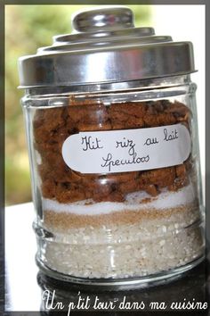 a jar filled with lots of food sitting on top of a table