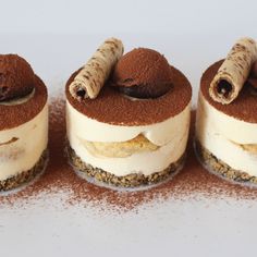 three desserts are arranged in the shape of cinnamon sticks on top of each other