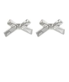 Indulge in the ribbon and bow trend with these fun metallic earrings. Featuring a ribbon design and a silver shine, they are sure to make a statement with any outfit! Acrylic Post back 3/4" L Available in silver only Chic Silver Jewelry With Ribbon, Chic Silver Earrings With Decorative Bow, Chic Silver Jewelry With Bow Tie Detail, Silver Satin Bow For Party, Silver Satin Party Bow, Silver Party Jewelry With Satin Bow, Silver Jewelry With Satin Bow For Party, Silver Ribbon Earrings For Formal Occasions, Silver Party Bow Tie