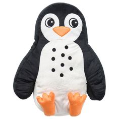 a penguin stuffed animal sitting on top of a white surface