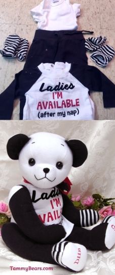 the stuffed bear is wearing black and white clothing