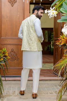 SKU: 21015 Meets opulence in this stunning ensemble: a pearl white raw silk kurta, gracefully complemented by an off-white hand-embroidered waistcoat, and finished with sleek plain raw silk trousers. Embrace the festive season with style and sophistication. Festive White Nehru Jacket With Dabka, Eid Nehru Jacket With Dabka On Raw Silk, White Raw Silk Bandhgala For Designer Wear, Off White Nehru Jacket With Dabka For Festive Occasions, Off White Lawn Suit With Naqshi For Festive Season, Off White Chanderi Sherwani For Wedding, White Chanderi Nehru Jacket With Dabka, Chanderi Nehru Jacket With Dabka For Wedding, White Chanderi Nehru Jacket With Chikankari Embroidery