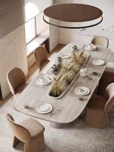 a dining room table with plates and place settings on it, surrounded by beige chairs