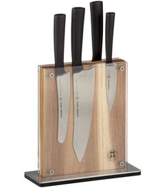 three knives in a wooden block with black handles