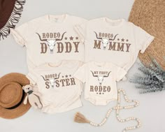 three matching shirts with the words rodeo mommy and baby sister on them next to a straw hat