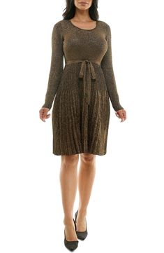 A fit-and-flare silhouette hugs your figure in a long-sleeve sweater dress with a ribbed texture and metallic shine. 39 1/2" length Scoop neck
 Long sleeves 78% rayon, 22% polyester Machine wash, tumble dry Imported Model stats: 5'10" height, 32" bust, 25" waist, 36" hip. Flare Sweater Dress, Daytime Dresses, Long Sleeve Sweater Dress, Ribbed Texture, Sleeve Sweater, Fit & Flare, Fit And Flare, Sundress, Scoop Neck