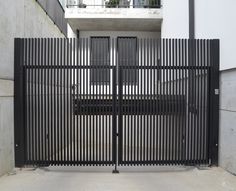 an iron gate in front of a building