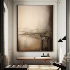 an abstract painting hangs on the wall above a bench in front of a wooden table