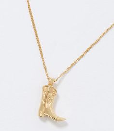 Saddle up and add a touch of unique charm to your jewelry collection with this boot necklace. Whether you're a fan of Western fashion or simply appreciate a statement piece with a touch of whimsy, this necklace featuring a gold-filled curb chain adorned with a charming cowboy boot pendant is as versatile as it is eye-catching. Material: Brass Dimensions: 18"L Weight: 0.02 oz. Imported Cowboy Boot Necklace, Megan Moroney, Concert Outfits, Cowboy Boot, Unique Charms, Curb Chain, A Fan, Concert Outfit, Western Fashion