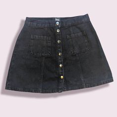 Black Denim Skirt With Front And Back Pockets. Front Snaps. Waist Is 29". Length Is 151/2". Black Denim Mini Skirt With Pockets, Edgy Black Denim Skirt With Pockets, Black Grunge Denim Skirt With Pockets, Black Denim Skirt With Pockets, High Rise Black Denim Mini Skirt, Black Denim Skirt With Button Closure, Black Denim Grunge Skirt, Black Mini Denim Skirt With Button Closure, Black Casual Denim Skirt With Button Closure