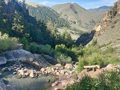 there is a bench on the side of this mountain