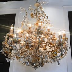 a chandelier hanging from the ceiling in a room