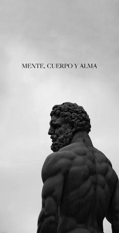 a black and white photo of a statue with the words mente, cueero y alma above it