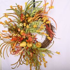 an arrangement of autumn flowers and foliage on a white background with the number 11 in the center