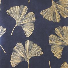 a blue and gold wallpaper with ginko tree leaf designs on it's side