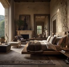 a large bedroom with stone walls and flooring