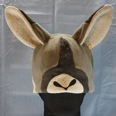 Ultrasoft fleece KANGAROO hat with large freestanding 3D ears, a solid base in natural colors, a dark muzzle block, accent color ear backs, a stenciled nose, and white or cream ear lining.     This hat's cozy layers will keep you warm through the coldest days! Perfect for cold weather outdoor fun, a costume, or to make a statement.  Will fit most adults. Multiple color variations are available so PLEASE specify which color style is preferred. Animal Ear Hat, Kangaroo Animal, Kangaroo Stuffed Animal, Ear Hats, Animal Ears, Skull Cap Beanie, Multiple Color, Skull Cap, Outdoor Fun