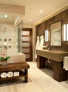 a bathroom with a sink, mirror and bathtub in it's own area