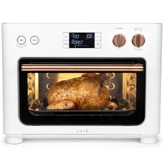 a chicken is cooking in an oven with the door open to show it's roasting process