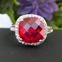 This Ring is made of lab Ruby Gemstone  and The Ring is Available in 925 Sterling Silver and Solid Gold /White Gold/ Rose Gold . Ruby Ring, 925 Sterling Silver, 14k Solid Gold Ruby Wedding ring for women, 12mm 8ct Checkerboard cut Red big  Gemstone, July Birthstone Jewelry, Woman's Gift Ring, mother's Ring Product Details: - Material:- 925 Sterling Silver/9k/14k/18k Solid Gold, White Gold, Rose Gold Main Stone:- Lab Ruby Stone size:- 12mm Stone Weight : 8Ct  (Feel Free TO Contact us if you want Luxury Sterling Silver Ruby Ring With Round Cut, Birthstone Wedding Ring, Rubin Ring, Ruby Wedding Rings, Mother's Ring, Ruby Wedding, Engagement Ring For Women, Mother Rings, July Birthstone Jewelry