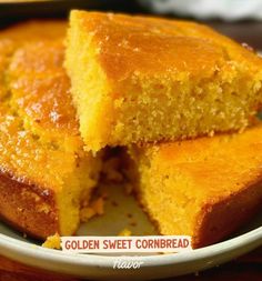 two pieces of cornbread on a plate with the rest of it cut in half