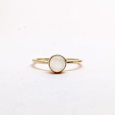 Natural Fine Moonstone Ring. Round Stone Ring. Semi Precious Gemstone Ring in 14k SOLID GOLD For Her from our Capsule Jewelry Collection. Round Moonstone Gemstones are set in Bezel Setting in our Factory. Gold Ring AA+ Quality. Perfect Gift For Everyday or June Birthstone Gift for Your Loved Ones. ►  DIMENSIONS : ◆ Gemstone : Moonstone 0.35 Cts                     ◆ Stone size : 6 mm                                           ◆ Shank Width : 1 mm      ◆  Material :  14k Yellow Gold          Made Adjustable Yellow Gold Moonstone Ring For Everyday, Fine Jewelry Stackable Round Pearl Ring, Fine Jewelry Stackable Pearl Ring, Gold Moonstone Ring In 14k Gold, Classic 14k Gold Moonstone Ring Gift, Classic 14k Gold Moonstone Birthstone Ring, Stackable Round Pearl Ring In Fine Jewelry Style, Stackable 14k Gold Pearl Ring With Round Band, Gold Midi Rings With Gemstone Round Shape