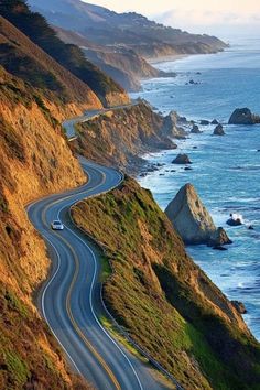 an image of a road going down to the ocean