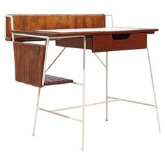 a wooden desk with two drawers and a metal frame on the bottom, against a white background