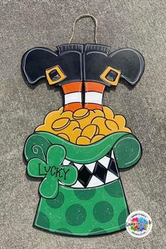 a wooden sign with a lepreti hat on it's head and the words lucky