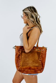 This is the leather bag you have dreamed about. The Bedstu Renata Bag in pecan is a favorite of ours at ECB. Such a rich and beautiful color that is perfect for the fall season. We can't wait to see how you style this gorgeous bag! Zipper ClosureRolled Leather HandlesHand Distressed Leather ExteriorInterior Zip Pocket12in.W x 12in.H x 3.5in.D12.5in. Handle Drop﻿Need help with sizing? No problem! Join our VIP group on Facebook, Everyday Chic Boutique VIP Insiders to chat directly with our team an Luxury Cognac Satchel For Fall, Cognac Bags With Leather Handles For Fall, Luxury Leather Handle Shoulder Bag For Fall, Elegant Cognac Bags For Fall, Chic Brown Hobo Bag With Leather Handles, Brown Top Handle Shoulder Bag For Fall, Everyday Cognac Shoulder Bag For Fall, Luxury Bags With Leather Handles For Fall, Elegant Bags With Braided Handles For Fall