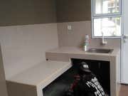 an empty washer and dryer in a small room