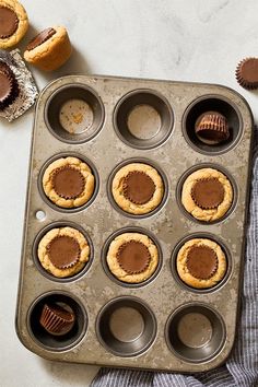 chocolate cupcakes in a muffin tin ready to be baked