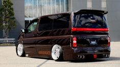 a brown van parked in front of a building