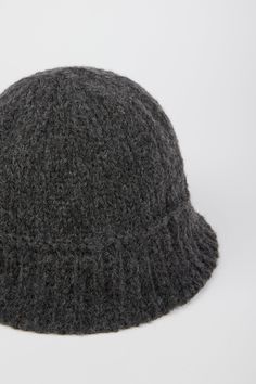 - Measurements: 1. Circumference: 60cm, 2. Length : 16cm- Materials: 50% acrylic, 30% wool, 20% nylon- Thickness: Moderate- Sheerness: None- Stretch: None- Lining: None- Care: Dry clean or hand wash cold and dry in shade Casual Wool Bucket Hat With Curved Brim, Casual Wool Cloche Hat For Winter, Casual Wool Bucket Hat, Classic Winter Bucket Hat, Casual Wool Bucket Hat For Winter, Ribbed Wool Hat For Fall, Wool Winter Bucket Hat, Fall Ribbed Wool Hat, Chunky Knit Wool Hat For Fall