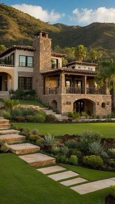 a large house with stone steps leading up to it's front yard and landscaping