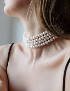 Add a touch of elegance and sophistication to your look with our stunning four-row pearl choker. Made with high-quality materials and expert craftsmanship, this choker necklace is a true statement piece that's sure to turn heads. Featuring fpur rows of lustrous pearls, this choker is designed to sit comfortably on your neck, making it the perfect accessory for special occasions or everyday wear. The pearls are carefully selected for their consistent size, shape, and luster, ensuring that each necklace is of the highest quality. The choker itself is made from durable materials, ensuring that it will last for years to come. The clasp is easy to use and secure, ensuring that the necklace stays in place throughout the day or night. Whether you're dressing up for a formal event or adding a touc Layered Pearl Choker, Jewellery Photography, Bracelets Easy, Real Pearl Necklace, Chunky Pearls, Wedding Necklaces, Pearl Chain Necklace, Layered Chokers, Natural Stone Earrings