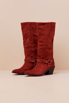 Create signature looks all season long with the help of the Lulus Assia Rust Suede Slip-On Knee-High Moto Boots! Ultra-soft faux suede shapes these slip-on boots with a pointed-toe upper that rises to a 13"" knee-high shaft with a 14.75"" circumference. Three matching studded straps come together at the outstep and instep via a bronze O-ring for a moto-inspired effect. A stacked block heel completes the look! 2. 5" stacked block heel. Cushioned insole. Rubbed sole has nonskid markings. Man Made White Ankle Boots, Square Toe Boots, Slip On Boots, Motorcycle Boots, Cool Boots, Heel Boots, Moto Boots, High Heel Boots, Black Ankle Boots