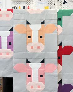 two farm animals made out of quilts on display