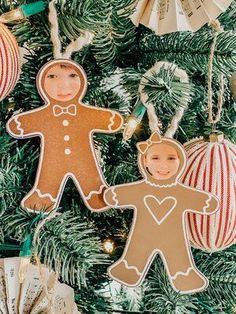 gingerbread cut out ornament hanging from a christmas tree with ornaments around it