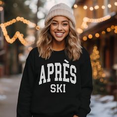 'Tis the ski-son to hit the slopes in style with our Apres Ski Sweatshirt. This trendy and cozy winter sweatshirt will keep you warm on those mountain top mornings all the way down to the crackling fire in the lodge. Our sweatshirts make great holiday gifts, especially for all the ski enthusiasts and snow lovers! Après Ski Sweatshirt, Women's trendy Sweatshirt, Ski Shirt, Ski Gifts, Gift for her, Winter Sweatshirt, Apres Ski sweater, holiday shirt A sturdy and warm sweatshirt bound to keep you w Sporty Tops For Winter Outdoor Activities, Winter Sports Sweatshirt, Sporty Sweatshirt For Winter Sports, Casual Winter Skiing Tops, Long Sleeve Ski Tops For Ski Season, Long Sleeve Skiing Tops For Ski Season, Long Sleeve Tops For Ski Season And Winter Sports, Long Sleeve Tops For Ski Season, Casual Tops For Winter Sports