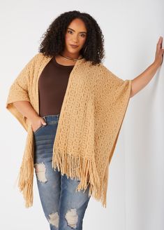 Our oversized ruana is the perfect PERFECT touch to your Fall outerwear! The open knit adds texture and coziness completed with fringe trimming. Knit Fringe Outerwear For Fall, Knit Outerwear With Fringe For Fall, Fringe Shawl Cardigan For Fall, One Size Knit Poncho With Fringe, Fringe Shawl Outerwear For Fall, Oversized Fringe Cape For Fall, Fall Fringe Cape Outerwear, Fringe Cape Outerwear For Fall, Oversized Fringe Sweater For Fall