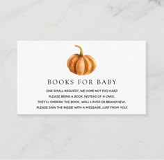 a white business card with an orange pumpkin on the front and words that read books for baby