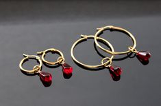 Pomegranate seed hoop earrings, Gold plated stainless steel Red 14k Gold Filled Jewelry For Gift, Gold Jewelry With Garnet Birthstone, Faceted Hoop Jewelry For Gifts, Elegant Faceted Hoop Earrings As Gift, Gold Garnet Jewelry For Gifts, Elegant Red Gold Jewelry, Gold Garnet Birthstone Jewelry, Gold Garnet Jewelry With Birthstone, Red Faceted Jewelry For Gifts