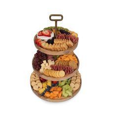 three tiered trays filled with different types of food on top of each other