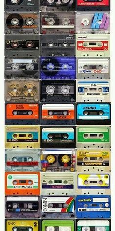 a large collection of cassette tapes stacked on top of each other in different colors and sizes