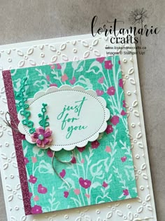 a close up of a greeting card with flowers and words on the front, along with an embellishment