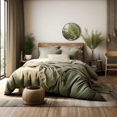 a large bed sitting in a bedroom next to a wooden table and chair with potted plants on it