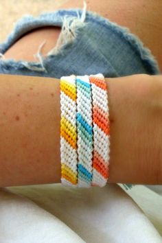 a close up of a person wearing two bracelets